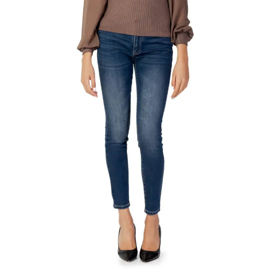 
                      
                        Armani Exchange Women Jeans paired with a brown sweater and black high heels
                      
                    