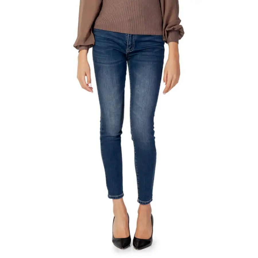 Armani Exchange Women Jeans paired with a brown sweater and black high heels