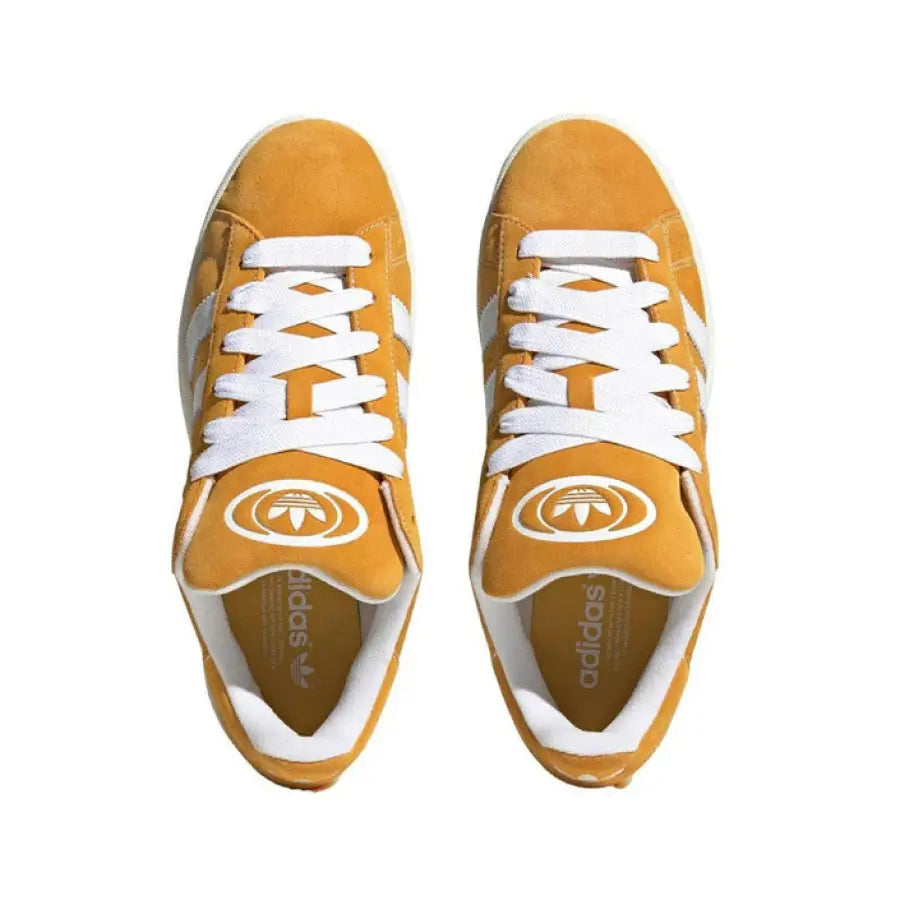 
                      
                        Yellow Adidas sneakers with white laces and stripes from Adidas Women Sneakers collection
                      
                    