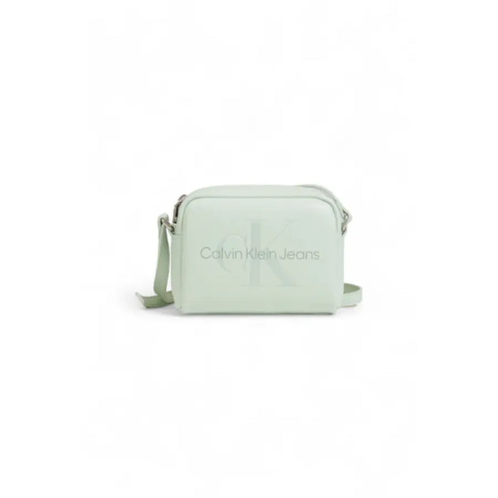 Pale mint green Calvin Klein crossbody bag featuring embossed logo for women