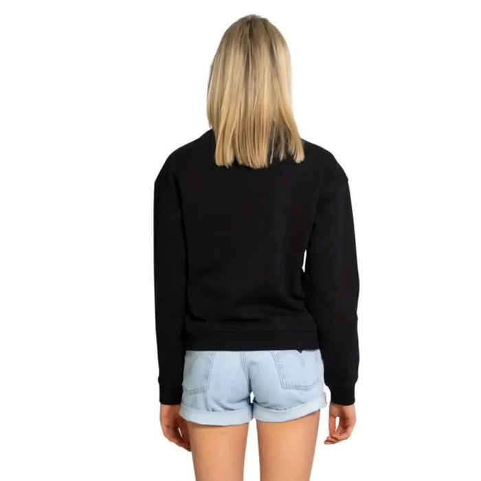 Armani Exchange - Woman in Black Sweater & Blue Denim Shorts, Back View