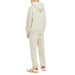 Person in light hooded sweatsuit and colorful sneakers from Jack & Jones