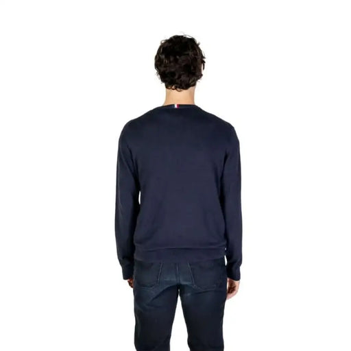 Person in navy blue sweater from behind, showcasing U.S. Polo Assn. Men Knitwear