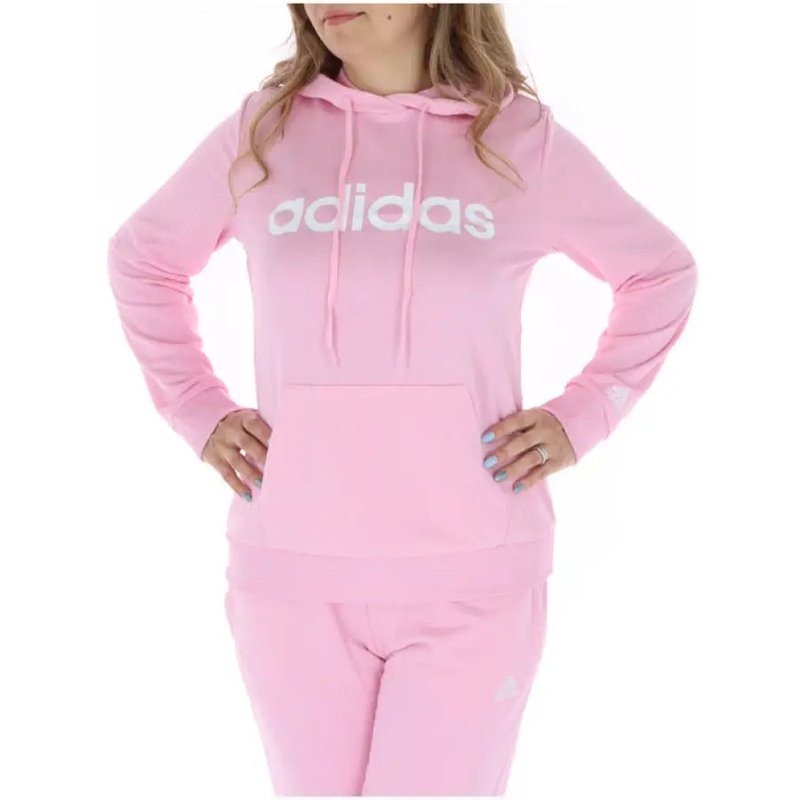 Person wearing Pink Adidas hoodie from Adidas - Adidas Women Sweatshirts collection