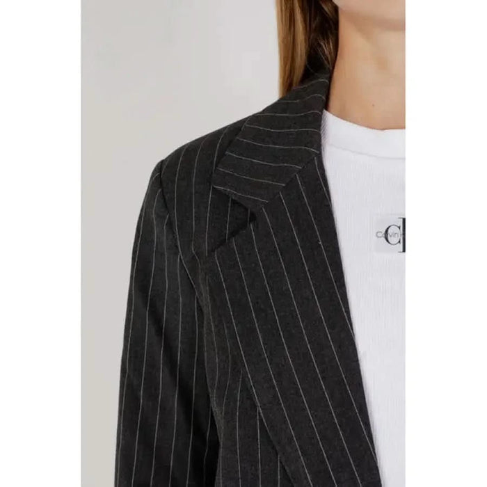 Pinstriped black blazer over white top by Only for women, elegant and stylish design