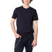 Young man with curly hair in a plain black Armani Exchange Men T-Shirt