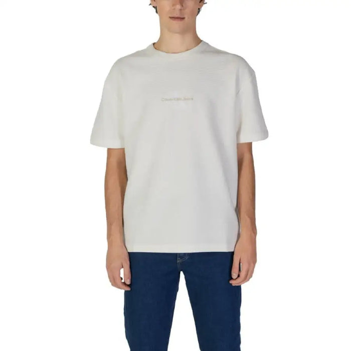 Plain white crew neck t-shirt paired with blue jeans from Calvin Klein Jeans