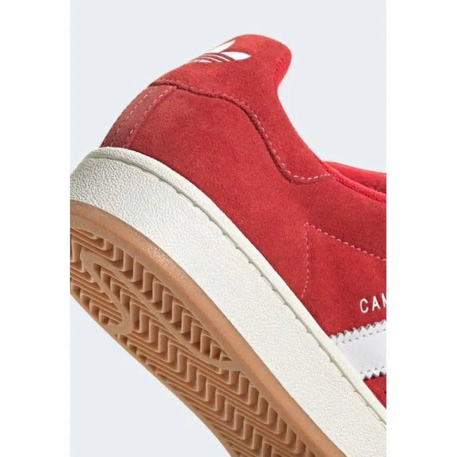 Red suede Adidas Campus sneaker with white stripes and gum rubber sole for women