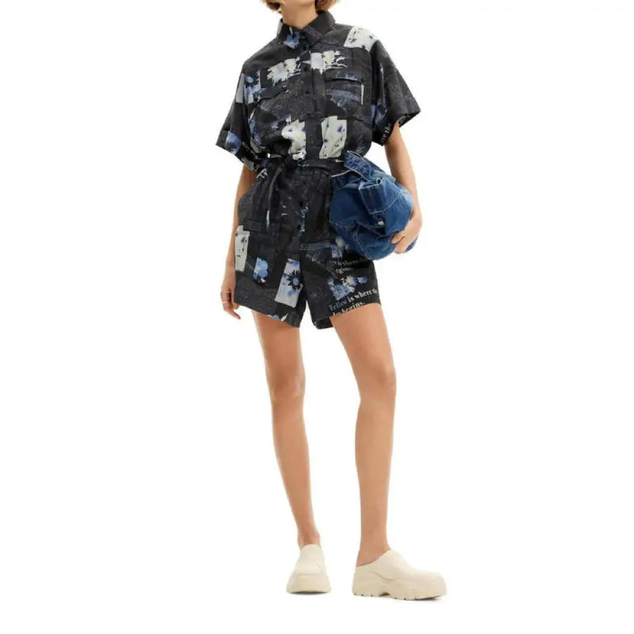 Desigual women’s short-sleeved romper with blue and white abstract pattern, belted waist