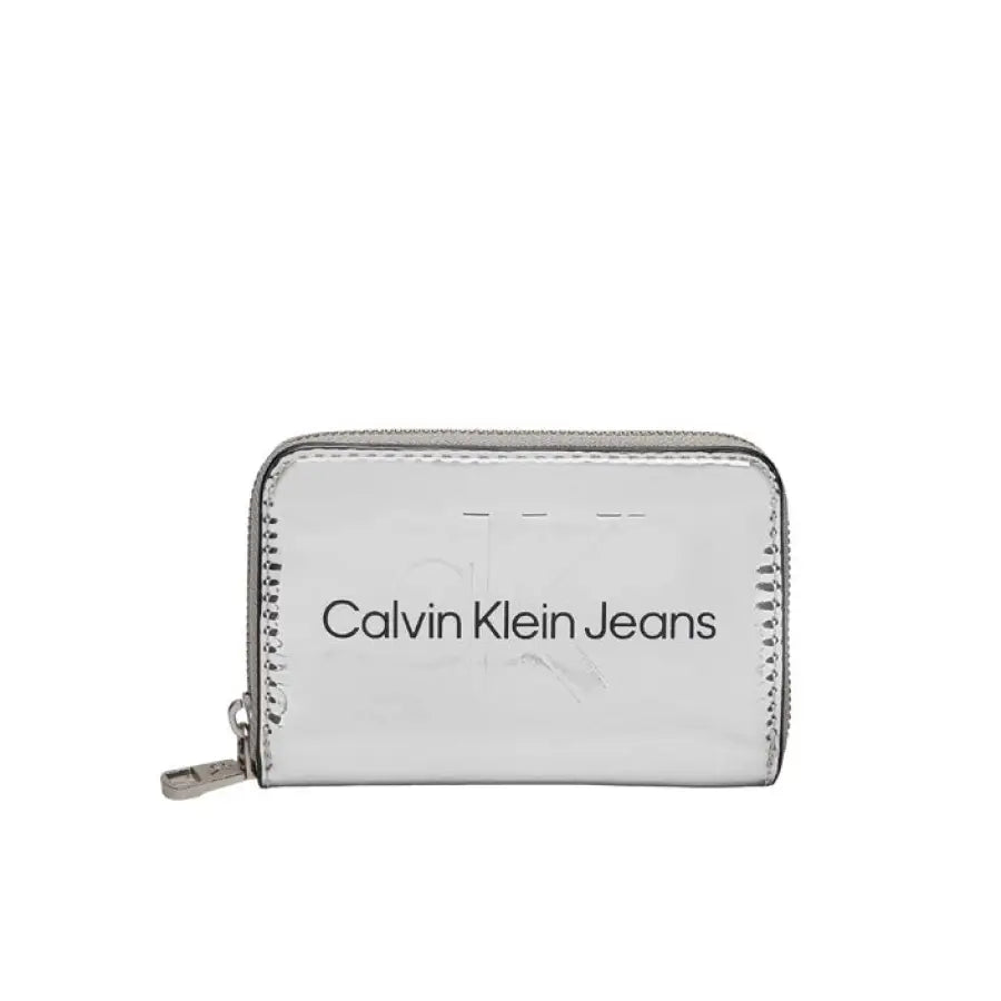 Silver metallic Calvin Klein Jeans wallet with zipper closure for stylish women’s accessory