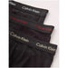 Stack of black Calvin Klein underwear featuring colorful branded waistbands