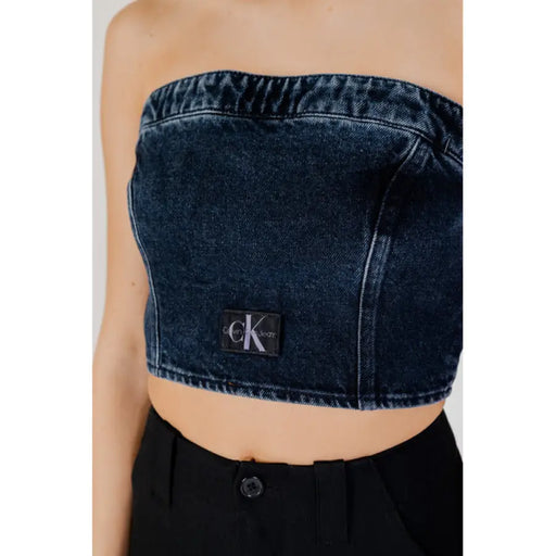 Strapless denim crop top featuring a Calvin Klein logo patch for women