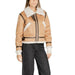 Tan shearling aviator jacket with white fleece trim and brown leather accents by Clerã©