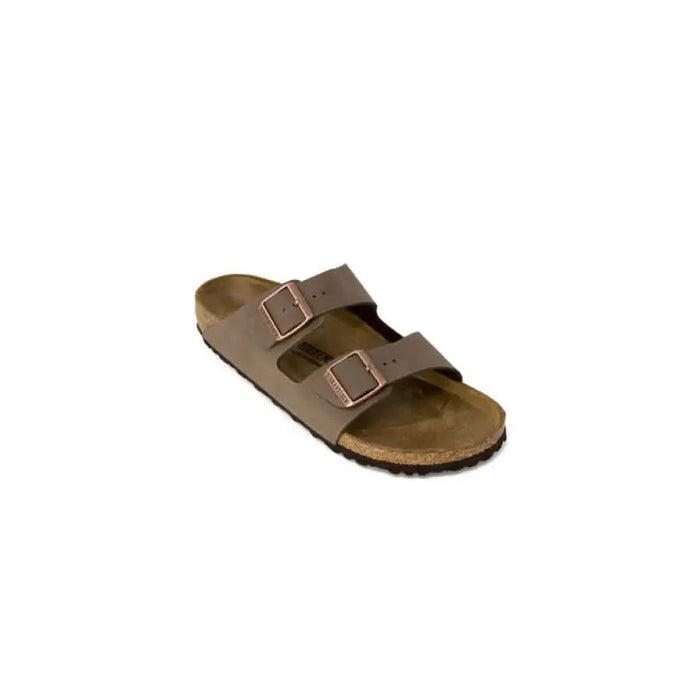 Tan leather Birkenstock sandal with buckle straps and contoured footbed for women