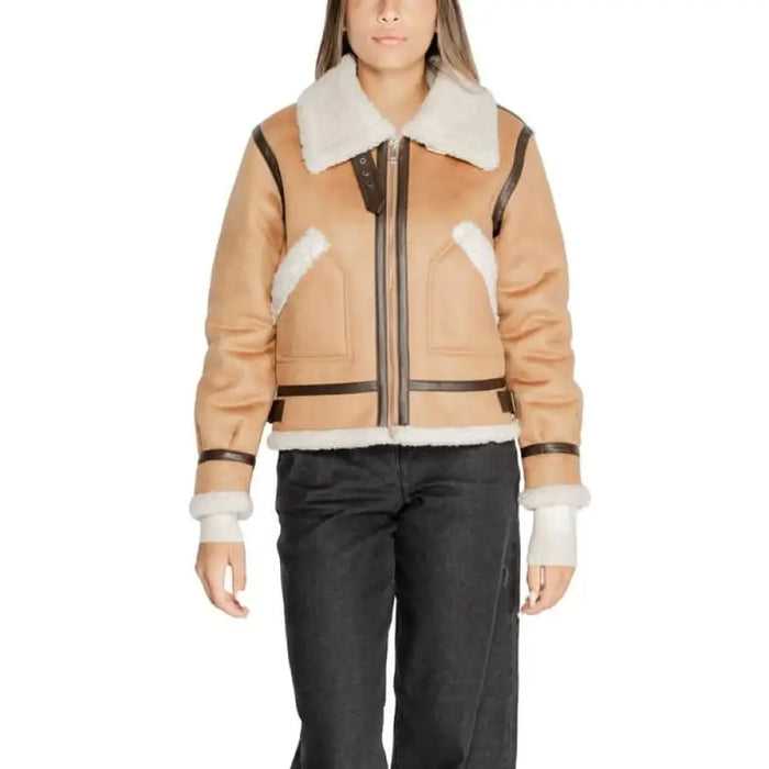 Tan shearling-trimmed bomber jacket with black leather accents from Cleré Women Jacket