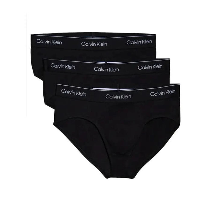 Three black Calvin Klein briefs with logo and elastic waistbands for men