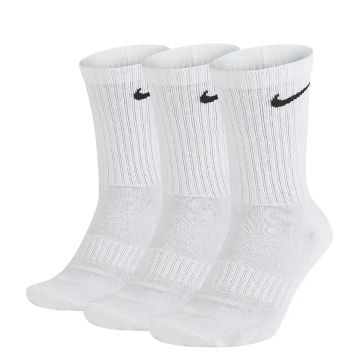 Three white Nike athletic crew socks featuring black logos for men’s underwear