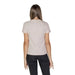 Back view of a beige short-sleeved t-shirt with black pants from Calvin Klein Jeans