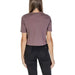 Back view of mauve short-sleeved Calvin Klein Sport Women’s T-Shirt with black jeans