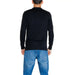 Back view of a person in a black sweater and blue jeans from Calvin Klein Jeans