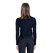 Back view of a person in Morgan De Toi Women Knitwear black long-sleeved top and dark pants