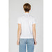 Back view of person in white Blauer Women T-Shirt and light blue jeans