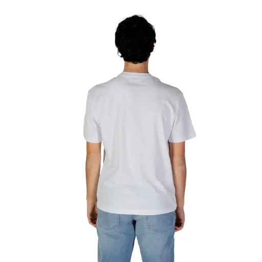 Back view of a person in Gas Men T-Shirt, white with light blue jeans