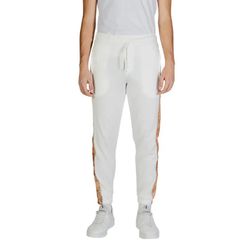 White athletic sweatpants with tan side stripes from Alviero Martini Prima Classe