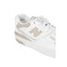 White and beige New Balance 550 sneaker with perforated leather upper for women