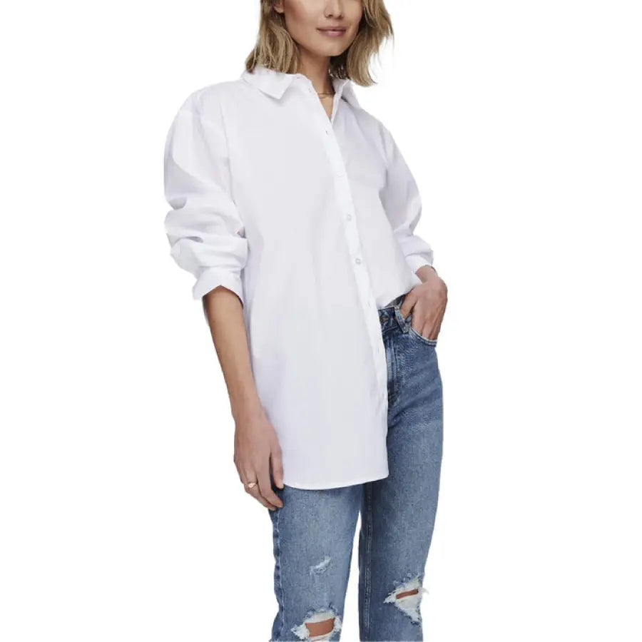 White button-down shirt styled with distressed blue jeans by Jacqueline De Yong for women