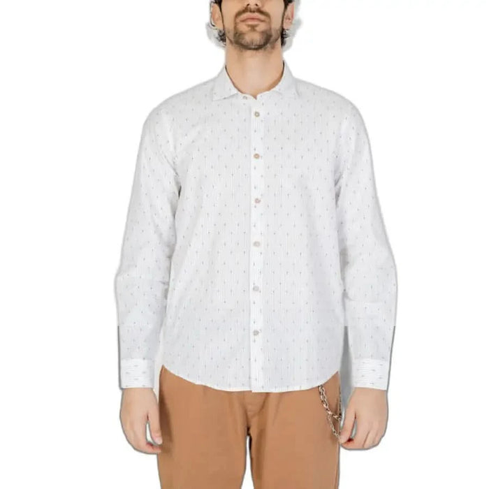 Model wearing Hamaki-ho Men Shirt, a white button-up with a subtle dotted pattern