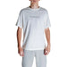 White Calvin Klein Men T-Shirt with embossed logo worn by a person