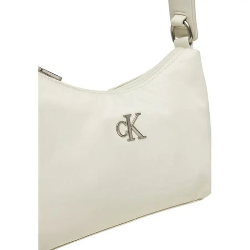 White Calvin Klein handbag featuring metallic CK logo from Calvin Klein Jeans collection