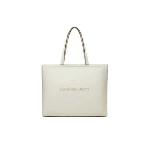 White Calvin Klein Jeans tote bag featuring metallic logo lettering for women