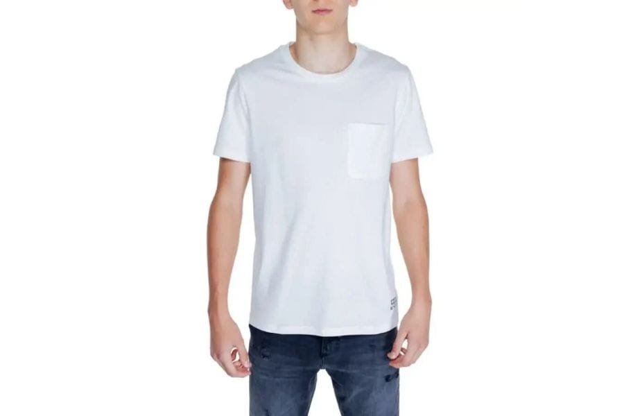 White crew neck t-shirt worn by a person in Men’s Capsule Wardrobe Guide article.