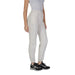 White elastic-cuffed sweatpants with black sneakers from Guess Active Women Trousers