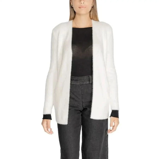 White fuzzy open-front cardigan with black trim by Morgan De Toi for women