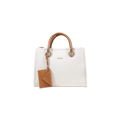 White Liu Jo handbag with brown leather handles and tan luggage tag