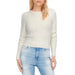 White knit sweater paired with light blue jeans from Only Women Knitwear