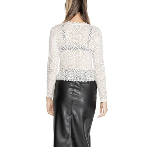 White lace long-sleeved top modelled by a woman with long brown hair from Morgan De Toi