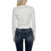 Guess - White lace-patterned sweater with dark jeans, back view in Guess Women Knitwear