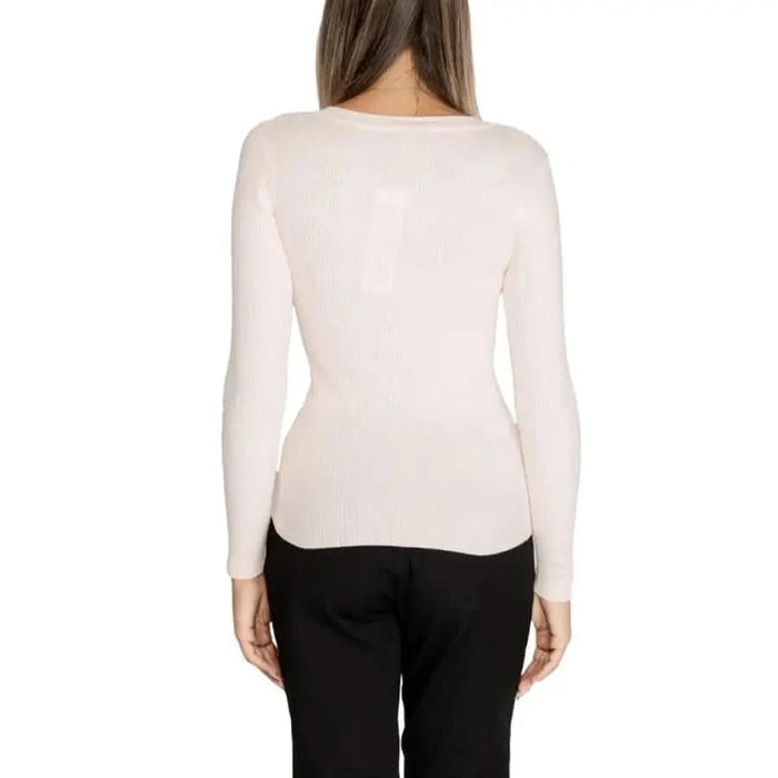 White fitted long-sleeved top worn by a model from behind in Morgan De Toi Knitwear