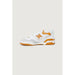 New Balance Women Sneakers: White and orange athletic shoe with chunky sole