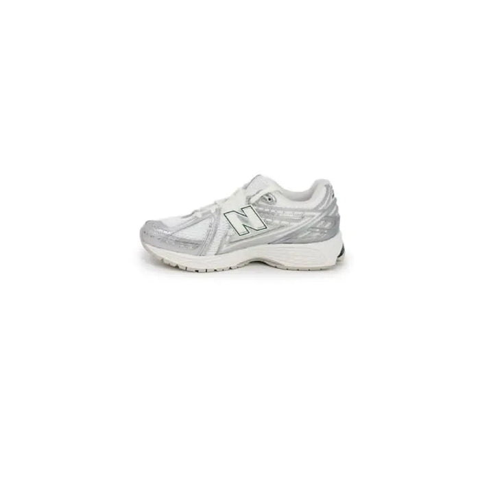 White and silver New Balance women sneakers with a chunky sole for running and casual wear