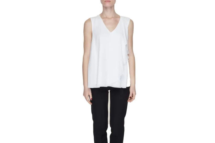 White sleeveless V-neck top with a flowy fit for stylish summer outfit ideas to shop.