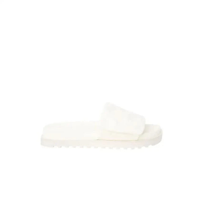 White slide sandal with a thick, textured sole from Guess Women Slippers collection