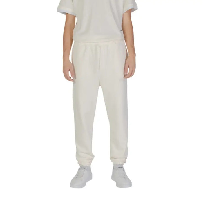 White Underclub Men Trousers featuring elastic cuffs at the ankles for a comfortable fit