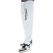 White Superdry sweatpants with vertical logo and black-white sneakers for men