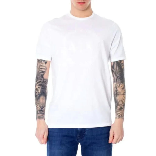 Armani Exchange Men T-Shirt in White, modeled by a person with heavily tattooed arms