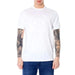 Armani Exchange Men T-Shirt in White, modeled by a person with heavily tattooed arms